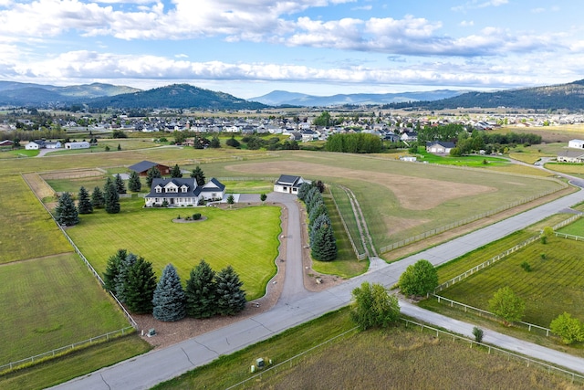 birds eye view of property featuring a mountain view