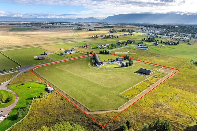 bird's eye view featuring a mountain view and a rural view