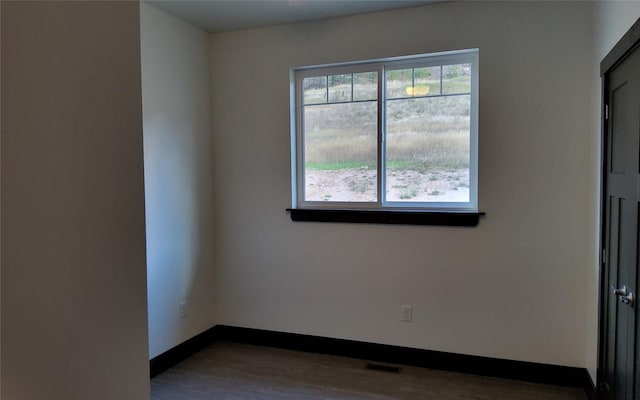 spare room featuring hardwood / wood-style flooring