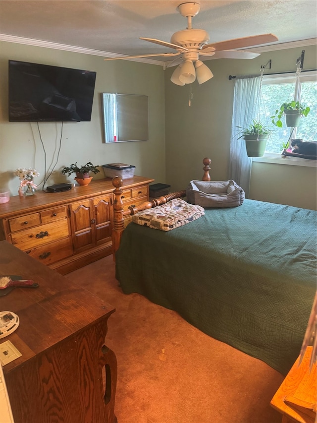 carpeted bedroom with ceiling fan and crown molding