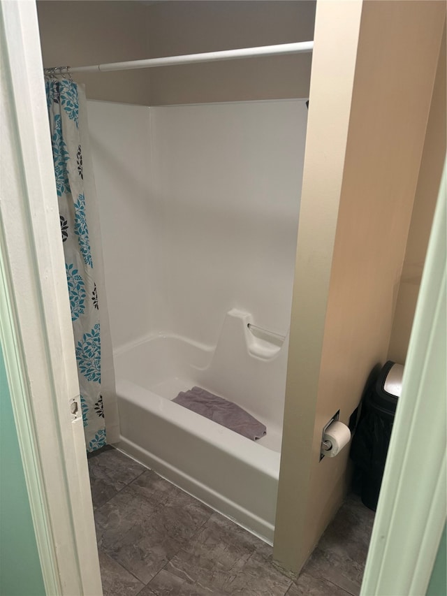 bathroom with shower / bath combination with curtain