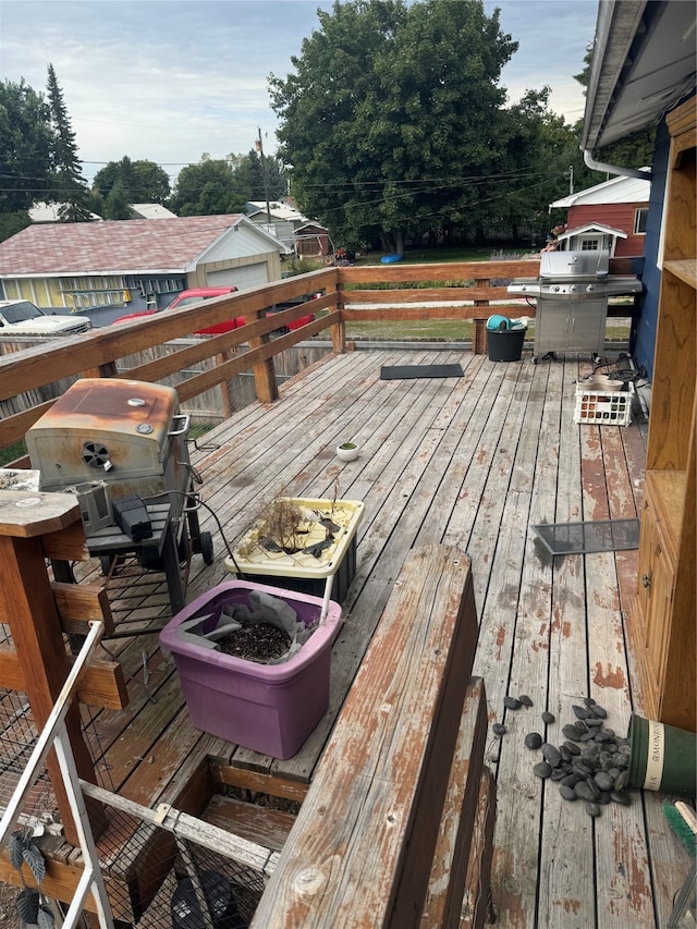 wooden deck with a grill