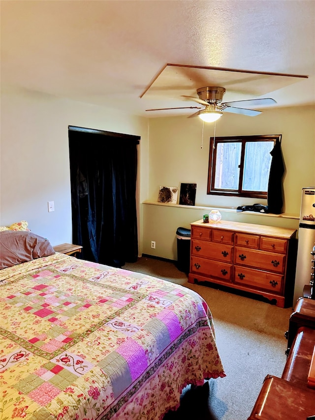 bedroom featuring dark colored carpet and ceiling fan