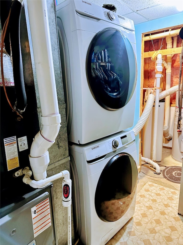 clothes washing area with stacked washer / drying machine