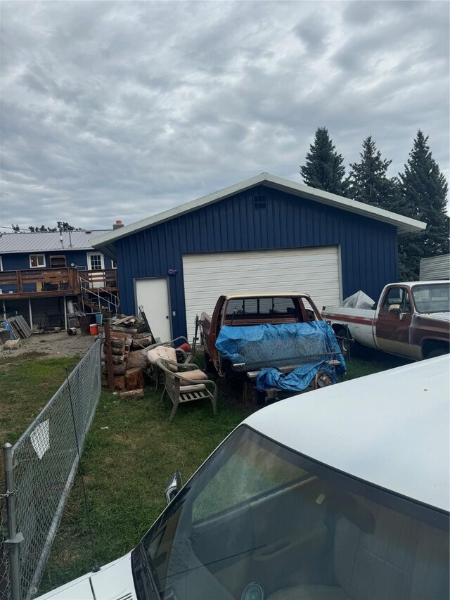 garage with a yard