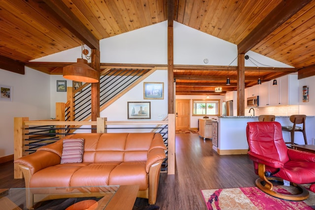 346 Crystal Lakes Dr, Eureka, MT 59917 - living area with dark wood finished floors, wood ceiling, and baseboards