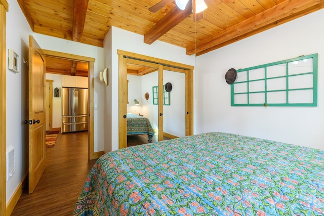 bedroom featuring stainless steel refrigerator, a closet, beam ceiling, ceiling fan, and hardwood / wood-style floors