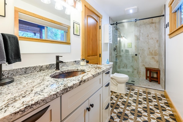 346 Crystal Lakes Dr, Eureka, MT 59917 - bathroom featuring a shower stall, vanity, toilet, and tile patterned floors