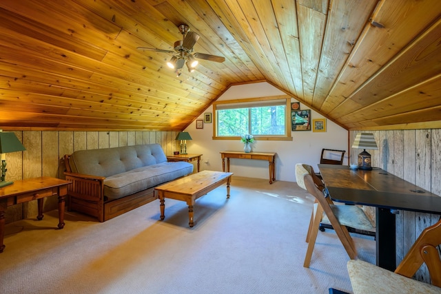 home office featuring vaulted ceiling, wooden ceiling, carpet flooring, ceiling fan, and wooden walls