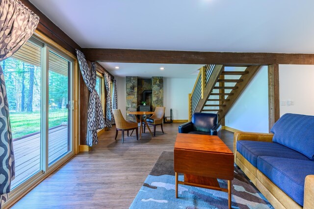 living room with wood-type flooring and a fireplace