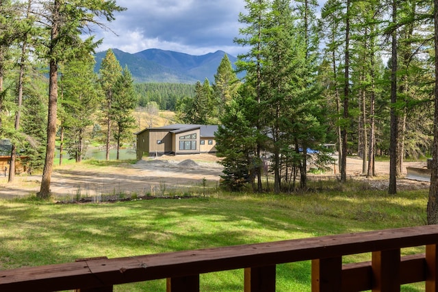 346 Crystal Lakes Dr, Eureka, MT 59917 - view of grassy yard featuring a mountain view and a forest view