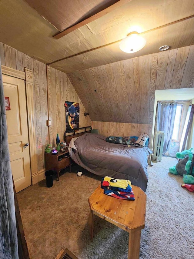 carpeted bedroom featuring wood walls, vaulted ceiling, and wooden ceiling