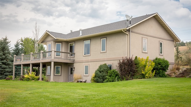 rear view of property with a yard