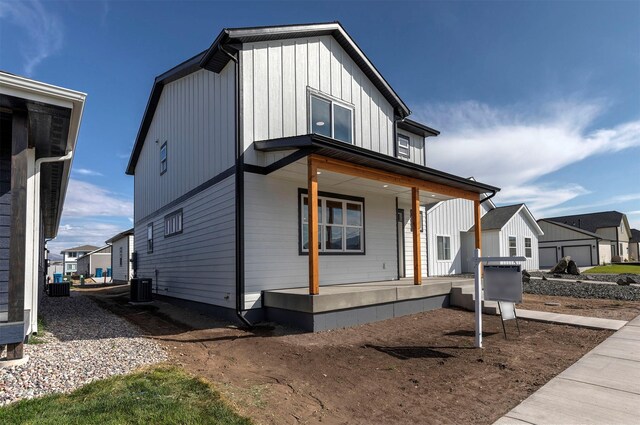 view of front of house featuring central AC unit and covered porch