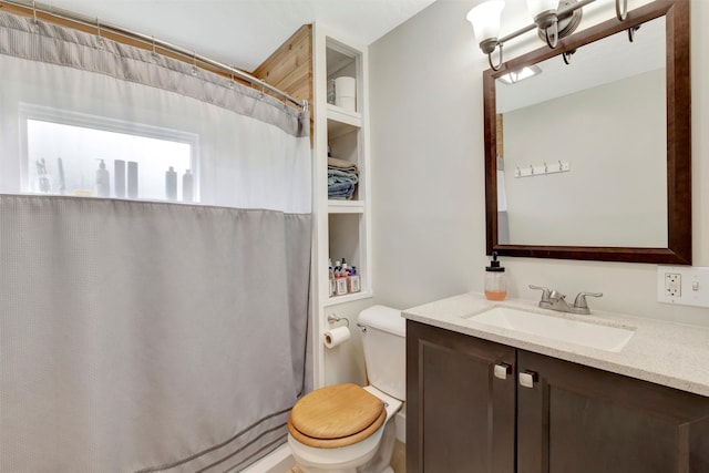 bathroom with a shower with curtain, vanity, and toilet