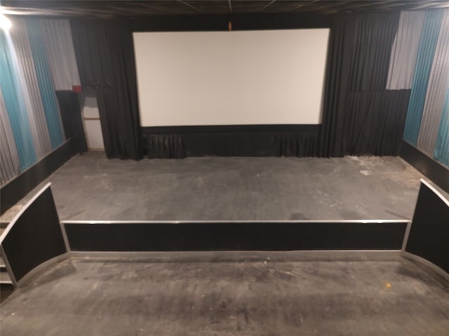 cinema room with concrete floors