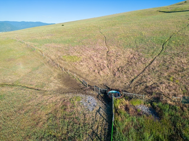 aerial view featuring a mountain view and a rural view