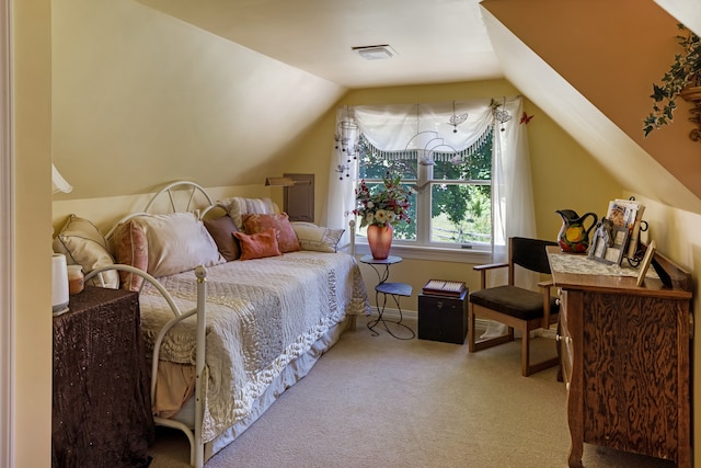 bedroom with lofted ceiling and carpet flooring