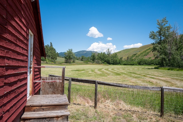 view of yard featuring a mountain view and a rural view