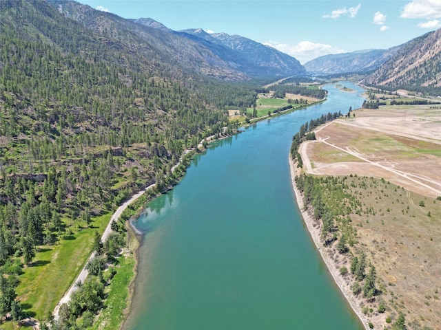 bird's eye view featuring a water and mountain view