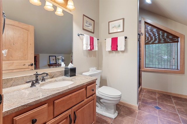 bathroom featuring vanity, toilet, tile patterned flooring, and a shower with door