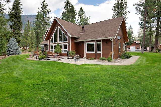 back of house featuring a yard and a patio