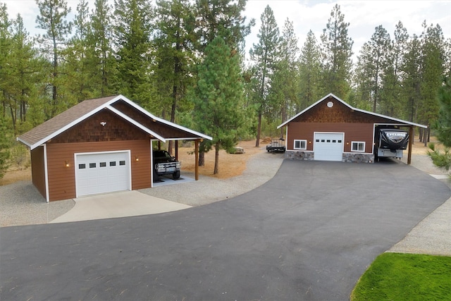 exterior space featuring an outbuilding, a garage, and a carport