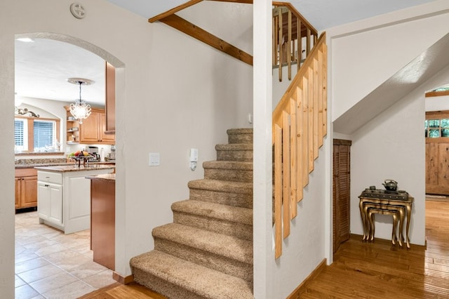 stairs featuring wood-type flooring