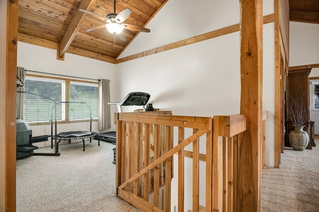 hall with carpet floors, wood ceiling, beam ceiling, and high vaulted ceiling