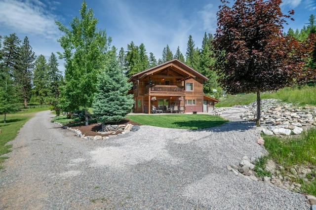 view of home's community with a lawn and a patio area