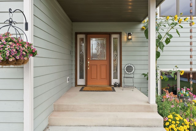 doorway to property featuring covered porch