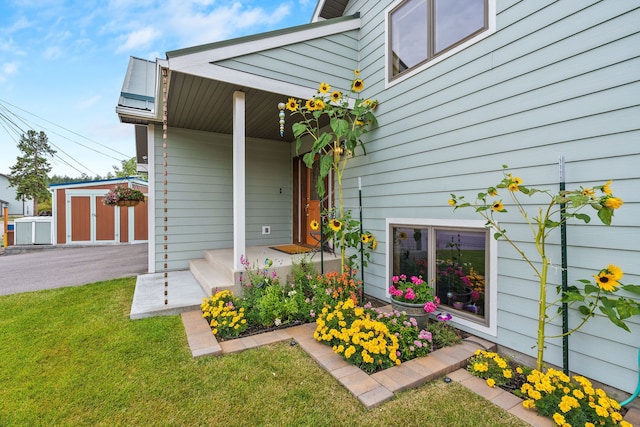 doorway to property featuring a yard