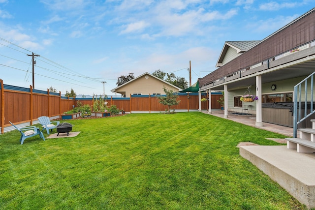 view of yard with an outdoor fire pit and a patio area