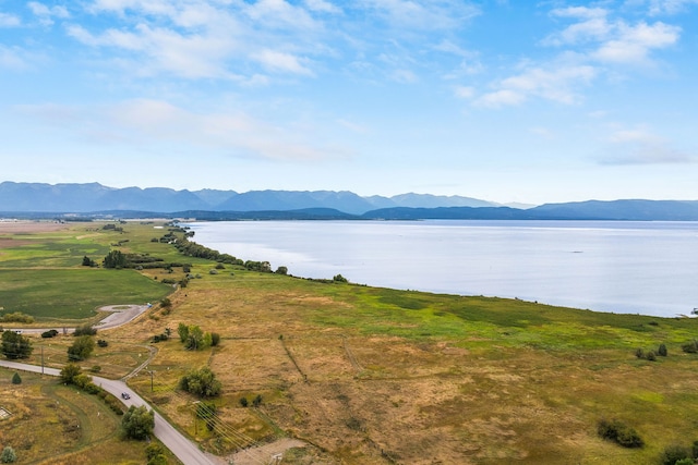 exterior space featuring a water and mountain view