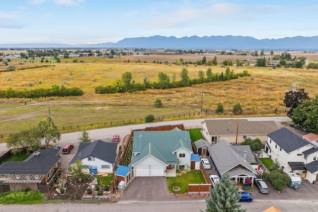 aerial view with a mountain view and a rural view