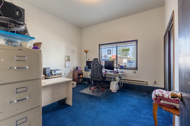 home office with a baseboard heating unit and dark carpet