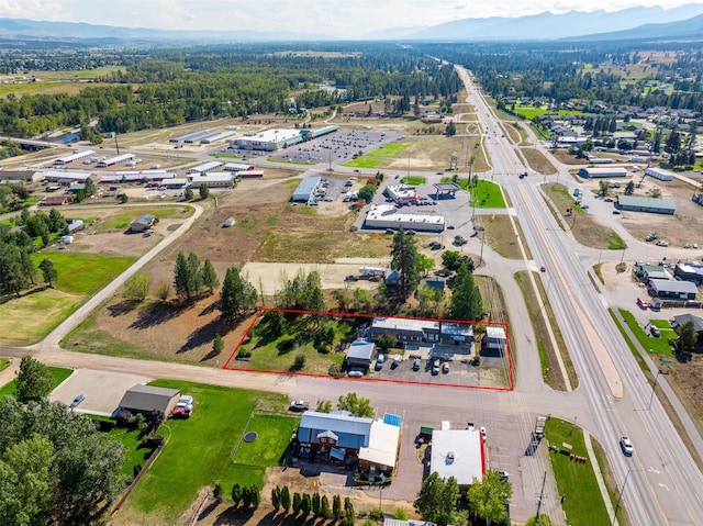 birds eye view of property with a mountain view