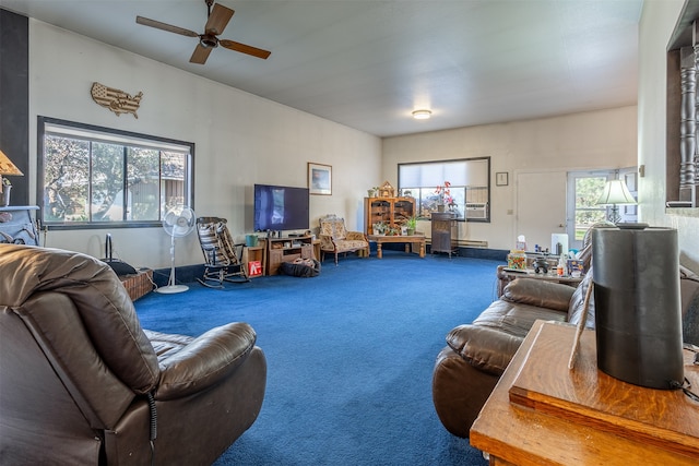 living area featuring a baseboard radiator, carpet, and a ceiling fan