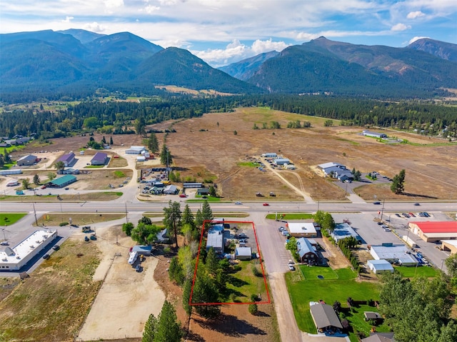 drone / aerial view featuring a mountain view