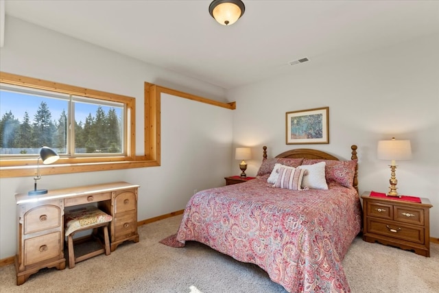 bedroom featuring light colored carpet