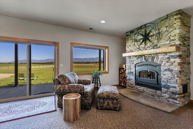 sitting room featuring a mountain view and a rural view