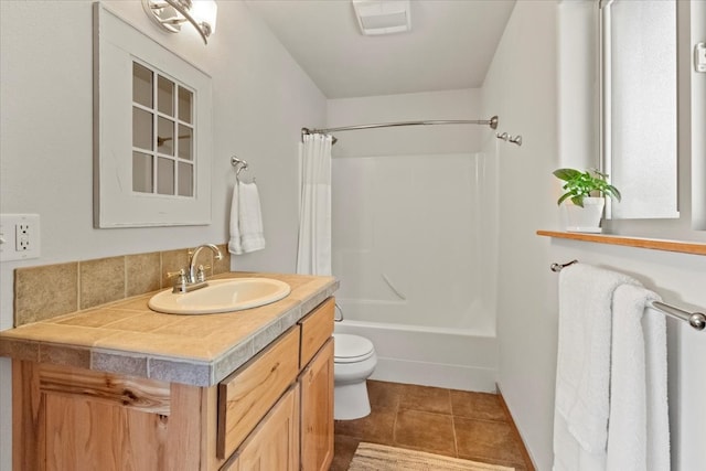 full bathroom with toilet, shower / tub combo, vanity, and tile patterned floors