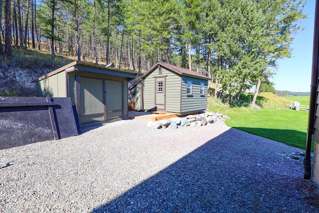 view of outdoor structure with a lawn