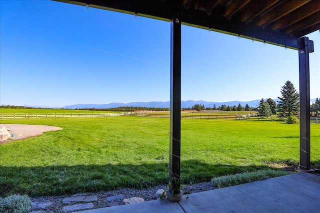 view of yard featuring a mountain view and a rural view