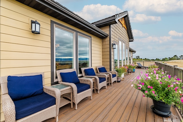 wooden deck with an outdoor hangout area