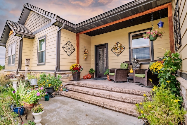 exterior entry at dusk with a porch