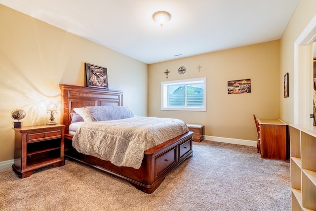 bedroom featuring light carpet