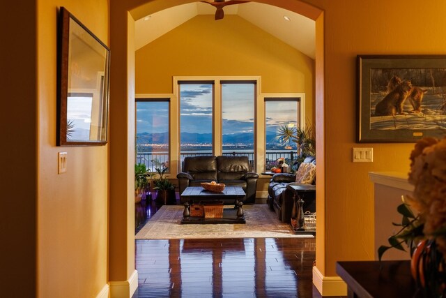 interior space featuring vaulted ceiling, ceiling fan, and hardwood / wood-style flooring