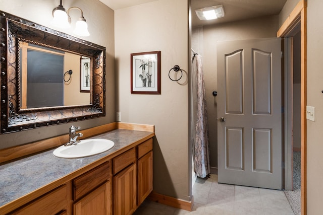 bathroom featuring vanity, curtained shower, and tile patterned floors