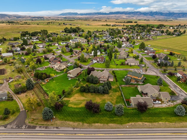 birds eye view of property with a mountain view and a rural view